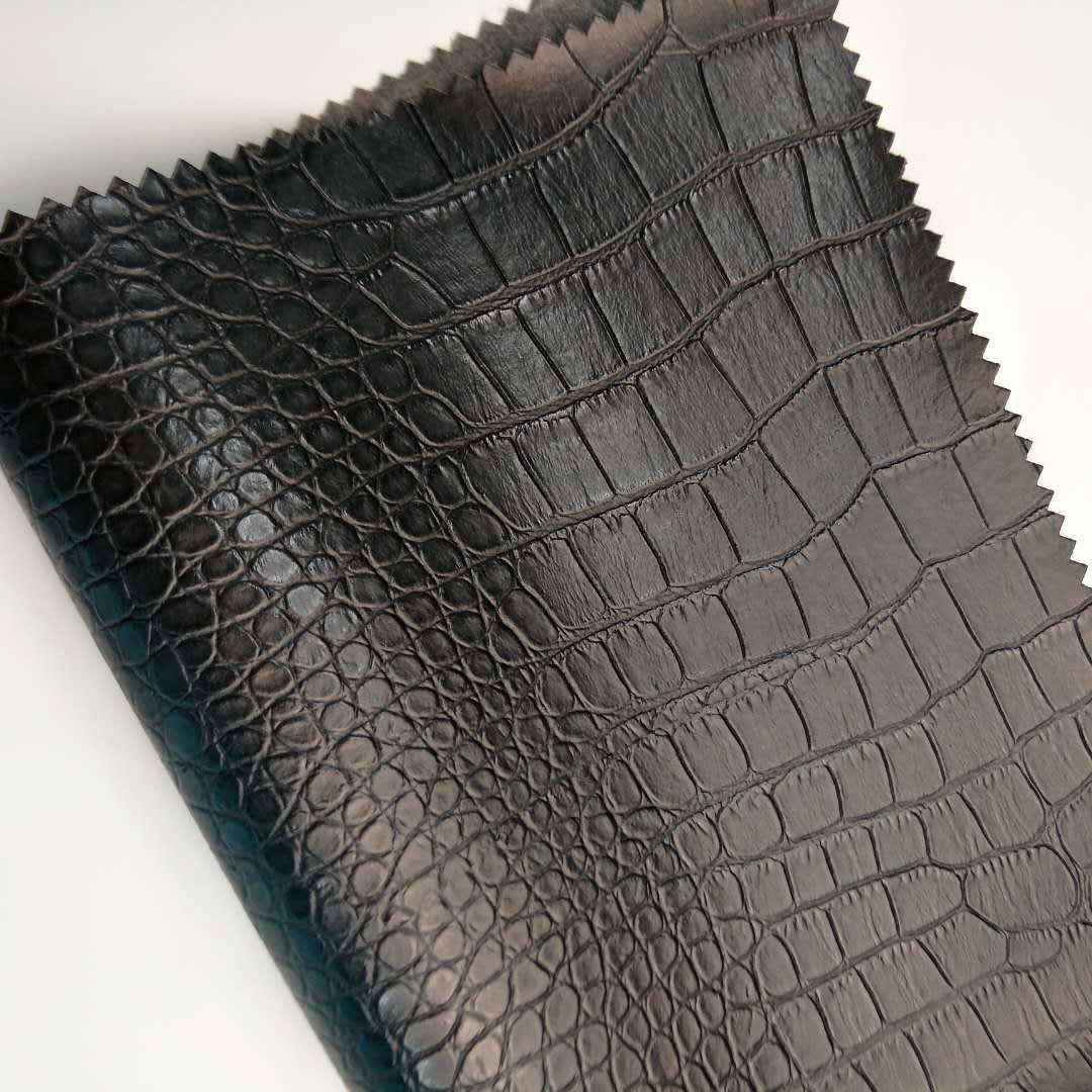 pvc PVC leather 0.8 knitted bottom semi-punched case and stationery holster fabric